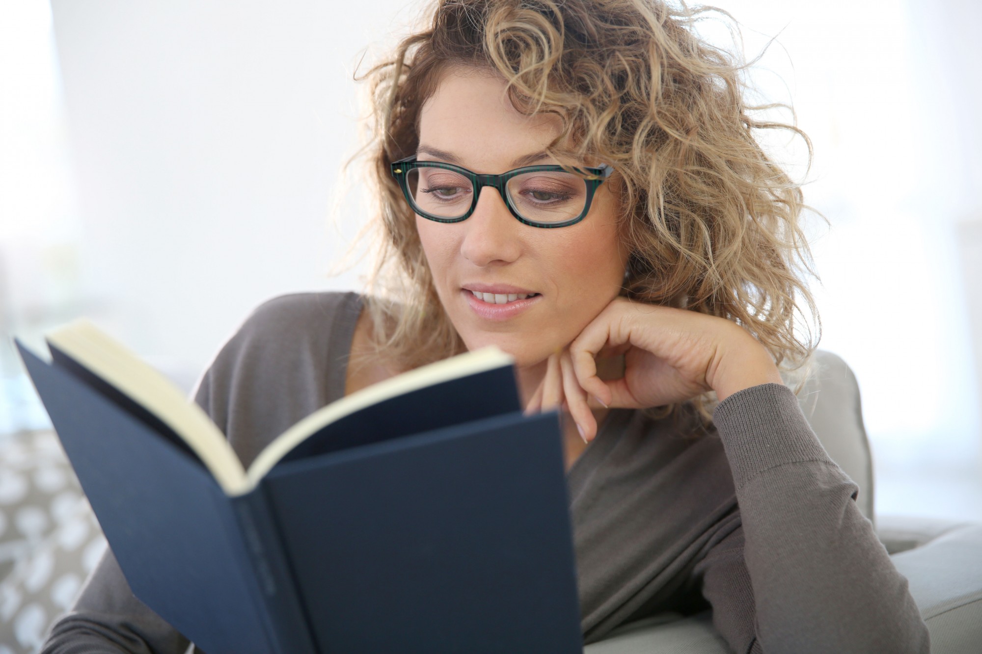 woman, glasses, reading, primary optics, primary colors, ashland ohio
